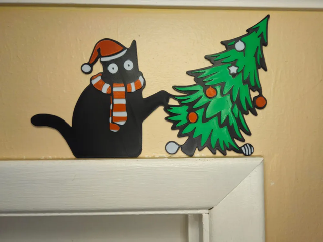 Gato Negro vs Árbol Navidad Topper