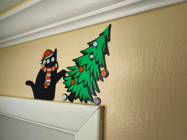 Gato Negro vs Árbol Navidad Topper