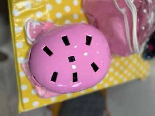 Casco rosa con estrellas y bolsa