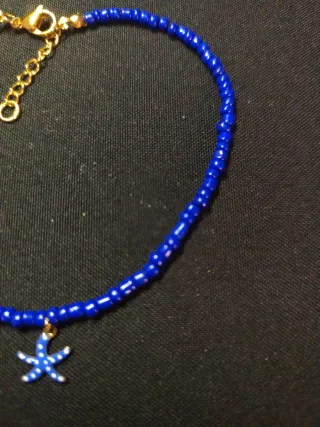 Tobillera azul con charm de estrella de mar