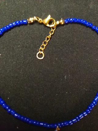 Tobillera azul con charm de estrella de mar