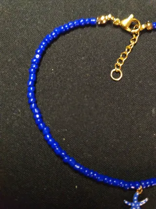 Tobillera azul con charm de estrella de mar
