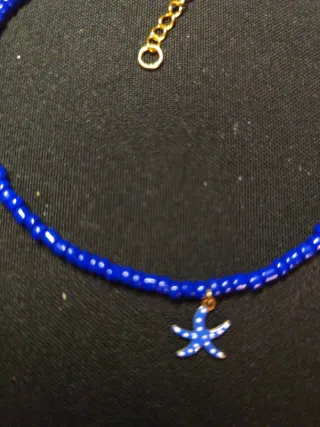 Tobillera azul con charm de estrella de mar