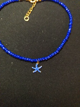 Tobillera azul con charm de estrella de mar