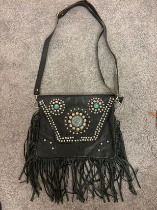 Bolso tipo clutch de piel negra