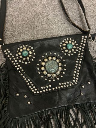 Bolso tipo clutch de piel negra
