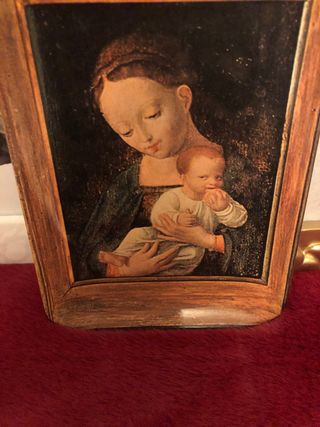 Marco de fotos dorado con ángeles