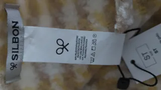 Bufanda Silbon cuadros blanco y amarillo.