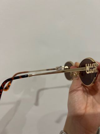 Gafas de sol Miu Miu doradas y marrones
