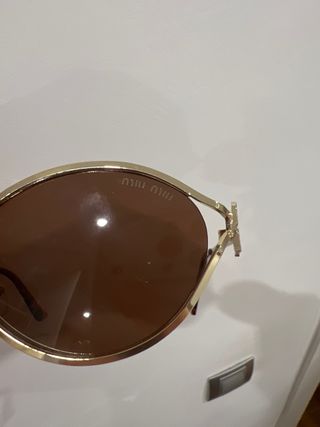 Gafas de sol Miu Miu doradas y marrones