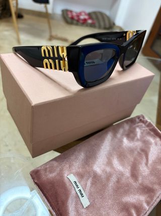 Gafas de sol Miu Miu Glimpse negras y doradas