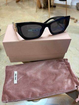 Gafas de sol Miu Miu Glimpse negras y doradas