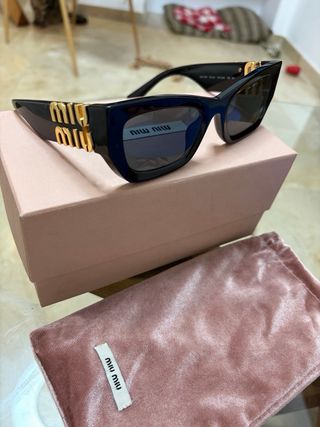 Gafas de sol Miu Miu Glimpse negras y doradas