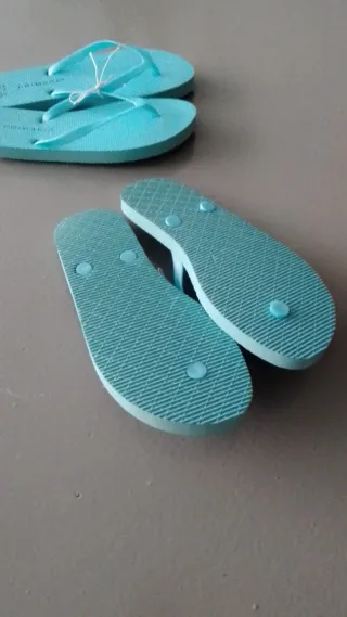 10 pares de chanclas de dedo, color azul turquesa