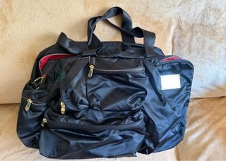 Bolsa de viaje Samsonite negra y fucsia