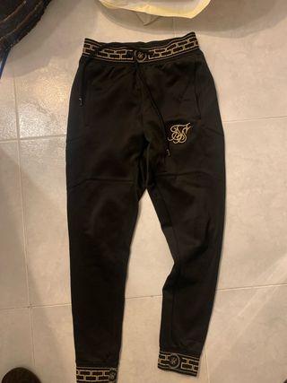 Pantalones SikSilk Negros y Dorados