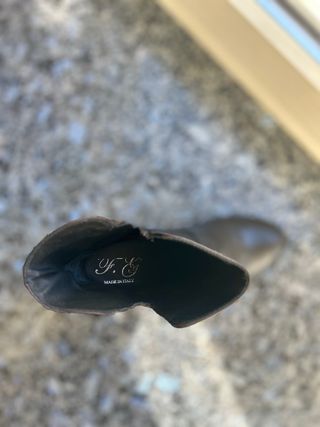 Stivali neri in pelle con frange