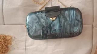 bolso de mano tipo clutch rígido