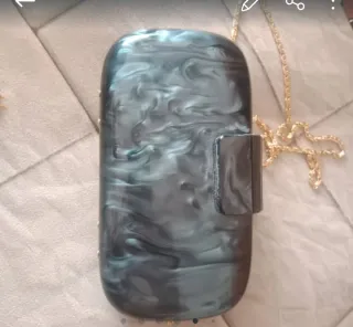 bolso de mano tipo clutch rígido