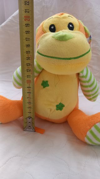 Peluche scimmia arancione e gialla