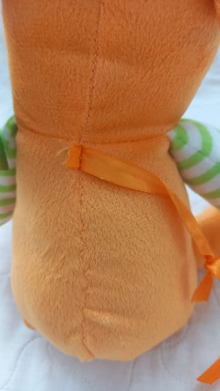 Peluche scimmia arancione e gialla