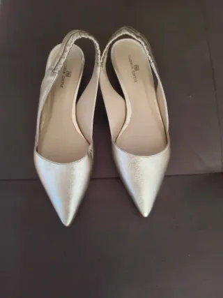 Zapatos planos dorados Gloria Ortiz