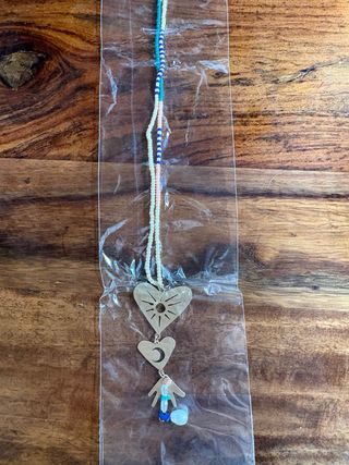 Collar largo Parfois Sol, Luna y Mano