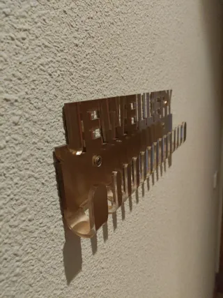 Colgador de joyas dorado