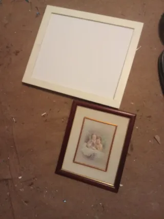 Dos marcos de fotos madera y cristal