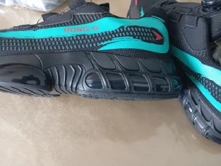 Zapatos de seguridad negros y turquesa