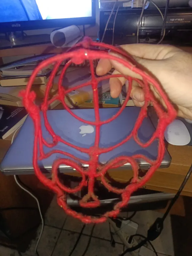 Scultura teschio in metallo