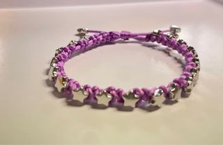 Pulsera artesanal estrellas morada
