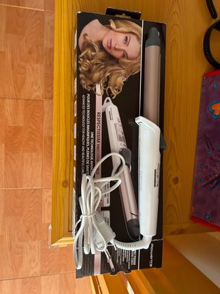 Rizador de pelo Rowenta color oro y blanco