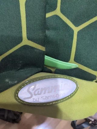 Mochila verde y multicolor Samsonite.Pequeña niños