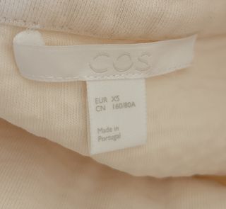 Jersey COS cuello alto algodón oversize marfil