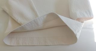 Jersey COS cuello alto algodón oversize marfil