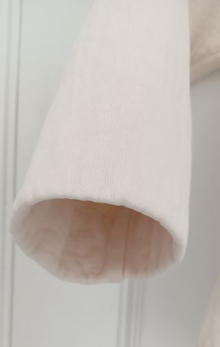 Jersey COS cuello alto algodón oversize marfil