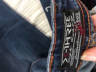 Jeans strappati blu uomo