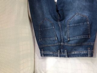 Jeans strappati blu uomo