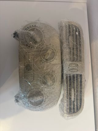 Consola A/A y rejilla coche