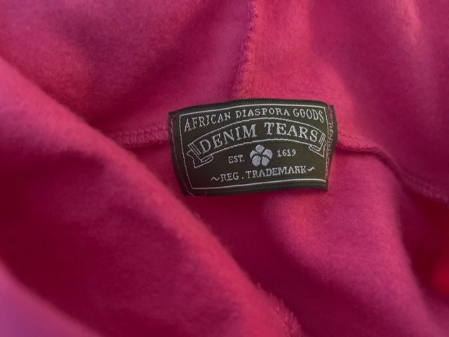 Sudadera Denim Tears rosa con estampado