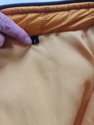 Chaleco acolchado naranja con cremallera