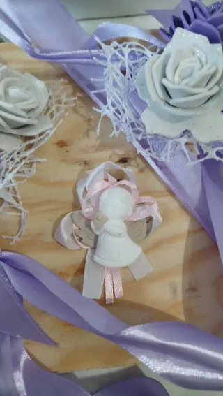 Nastri decorativi con fiori e angioletto