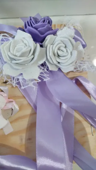 Nastri decorativi con fiori e angioletto