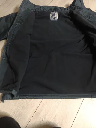 Parka de abrigo y de protección de mangas desmonta