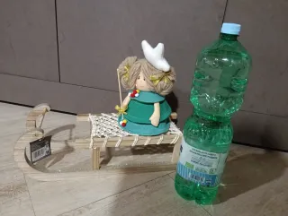 Slittino decorativo in legno e macramè