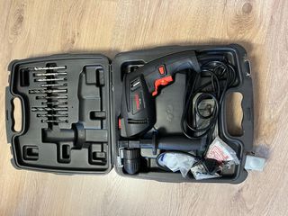 Taladro percutor con maletín y brocas