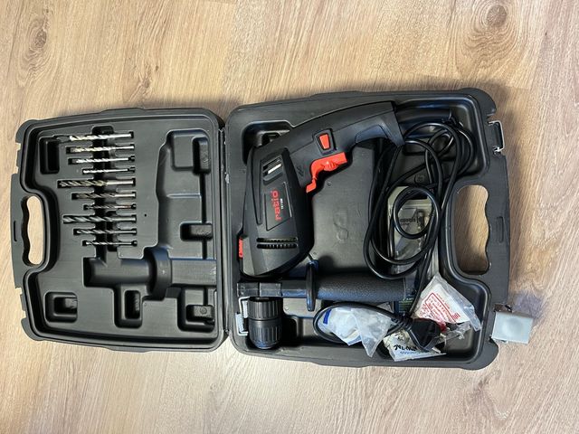 Trapano a percussione con valigetta e punte