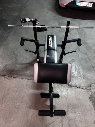 máquina de gimnasio + pesos