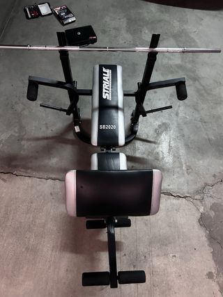 máquina de gimnasio + pesos